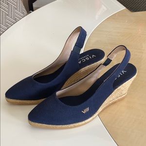 Size 7, navy blue wedges. Never worn. 3 inch heel